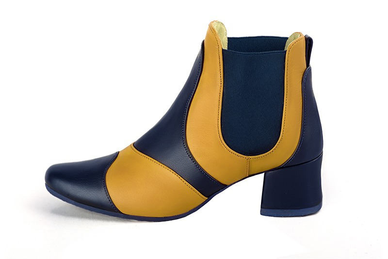 Step out in two-tone leather Chelsea ankle boots with contrasting elastic side gussets for a bold, modern graphic style, in navy blue and mustard yellow leather with round toe and low flared heel - Florence KOOIJMAN